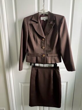 Brown 2 piece suit with luxury multi colored rhinestone buttons. A Show Stopper!